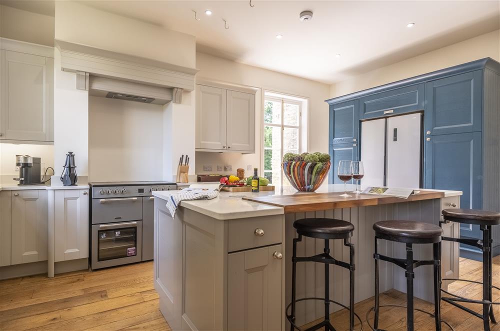 Well-equipped kitchen with electric range oven at The Vicarage and Cottage, Great Limber