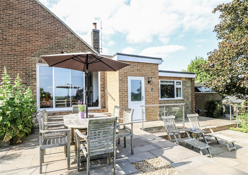 Enjoy a glass of wine on the patio at The View @ Orchard View, Hognaston