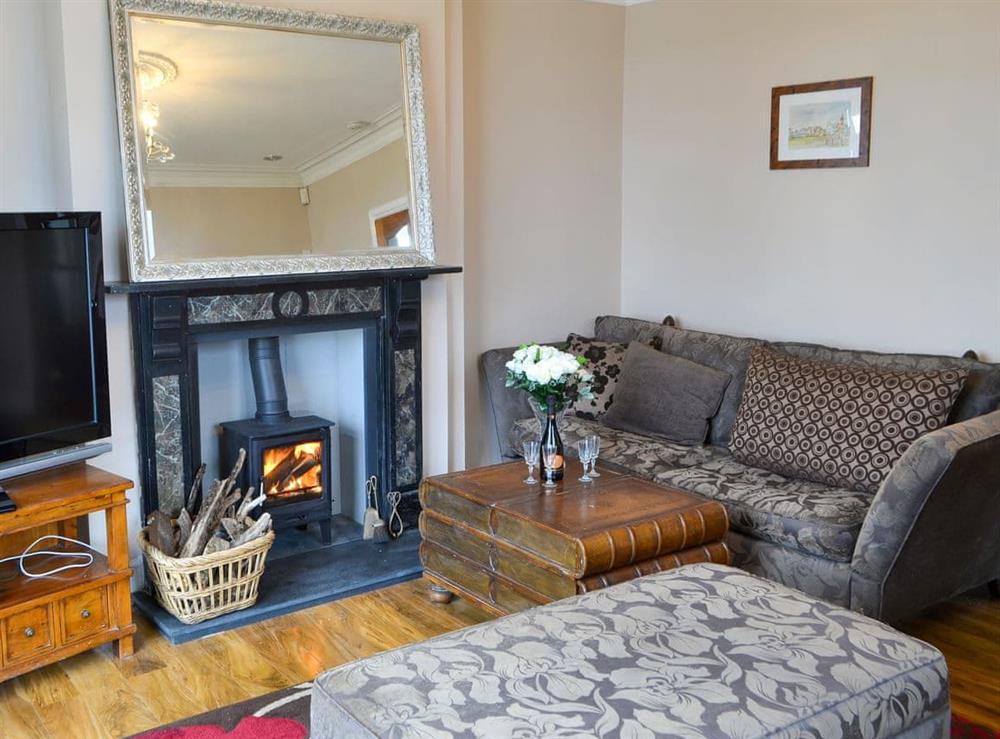 Welcoming living room with wood burner at The View Old Coastguard Cottage in Tynemouth, Tyne and Wear