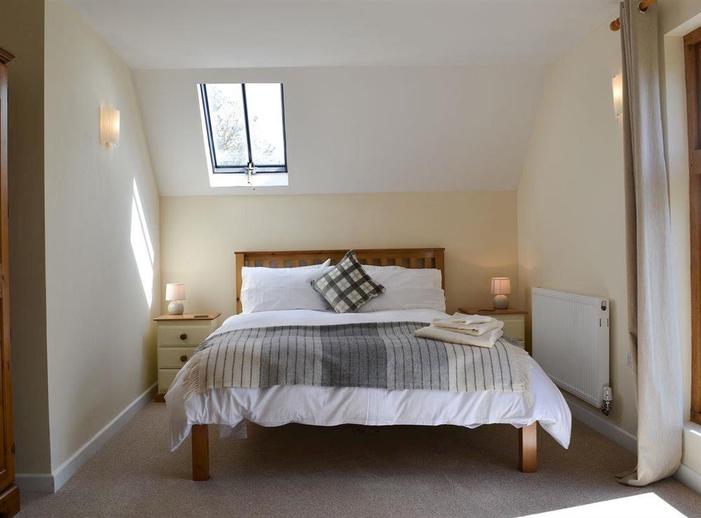 Double bedroom with king-size bed at The Wagon House in Newcastle, near Craven Arms, Shropshire