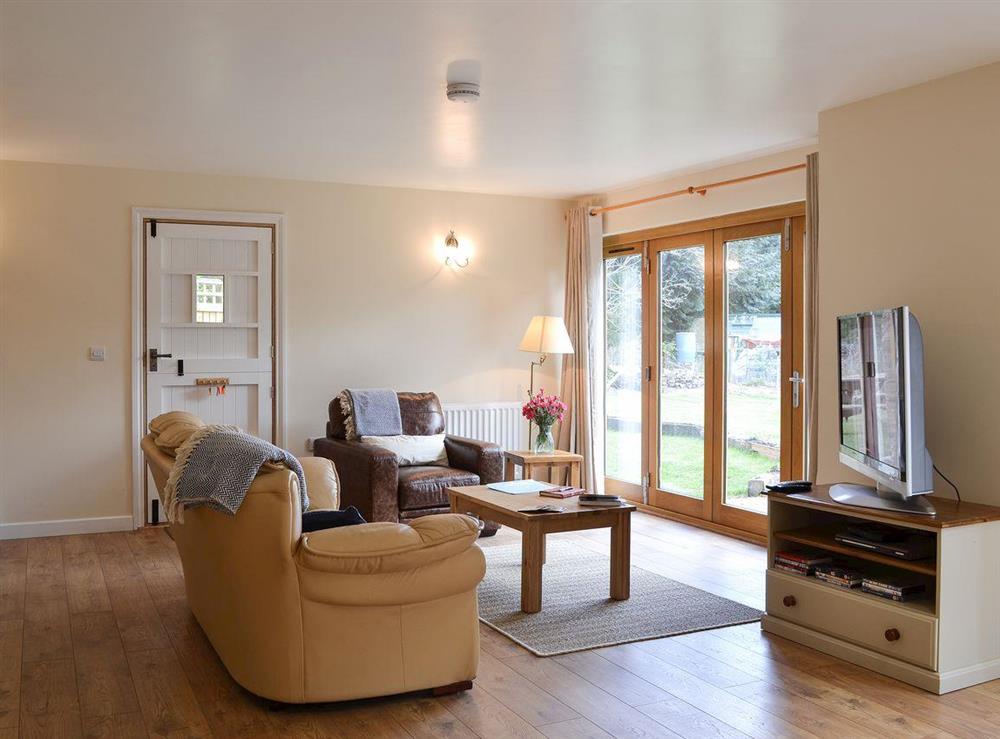 Open plan living space at The Wagon House in Newcastle, near Craven Arms, Shropshire