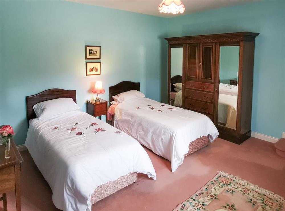 Roomy bedroom with twin beds at The Wain House in Weston Rhyn, near Oswestry, Shropshire