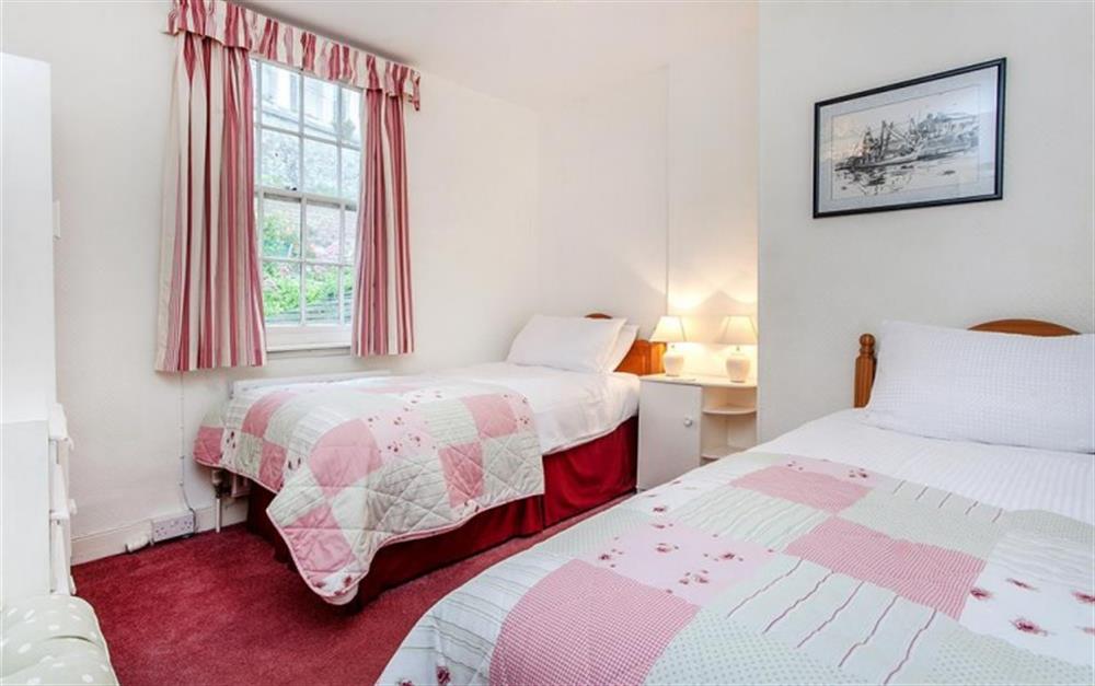 Bedroom 1 with twin beds at The Walk in Lyme Regis