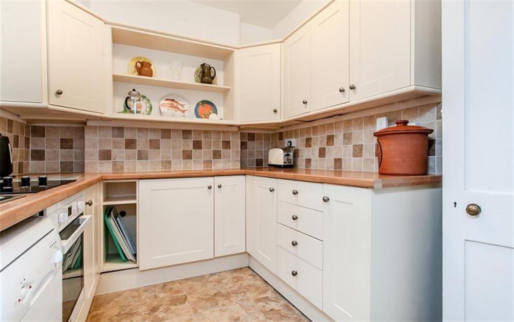 The Kitchen with electric cooker, microwave, washing machine, fridge-freezer and dishwasher at The Walk in Lyme Regis