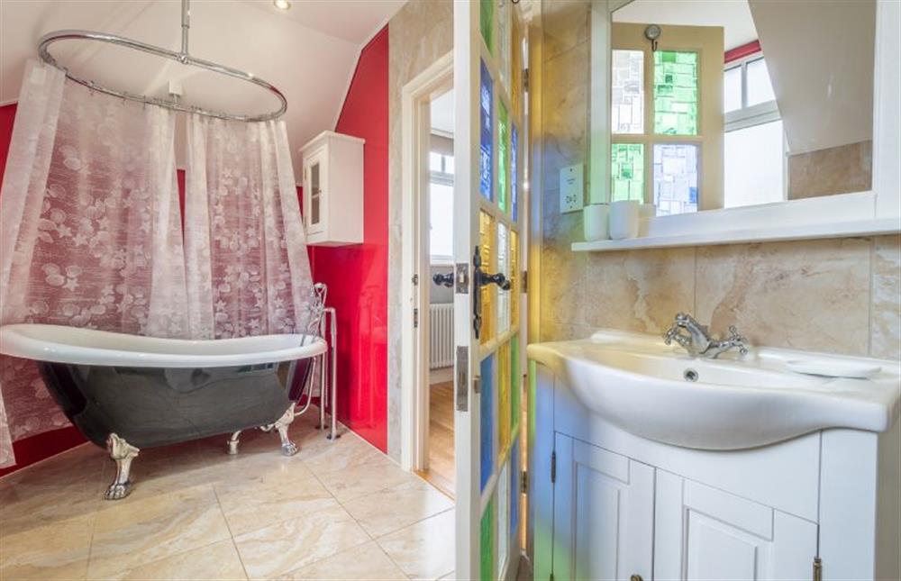 First floor: Family bathroom has a roll-top bath and shower and canopy over at The Warren, Old Hunstanton