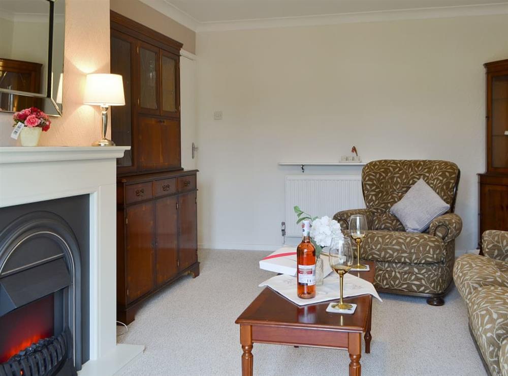 Feature fireplace within living room at The Warren in Whitstable, Kent