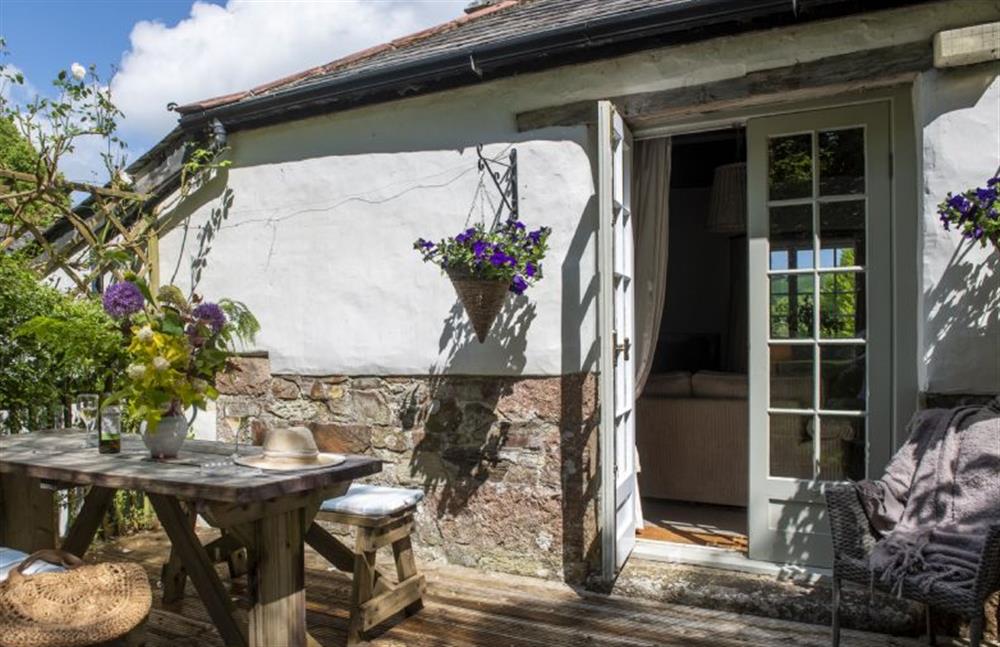 Doors lead from the sitting room to this lovely raised decking