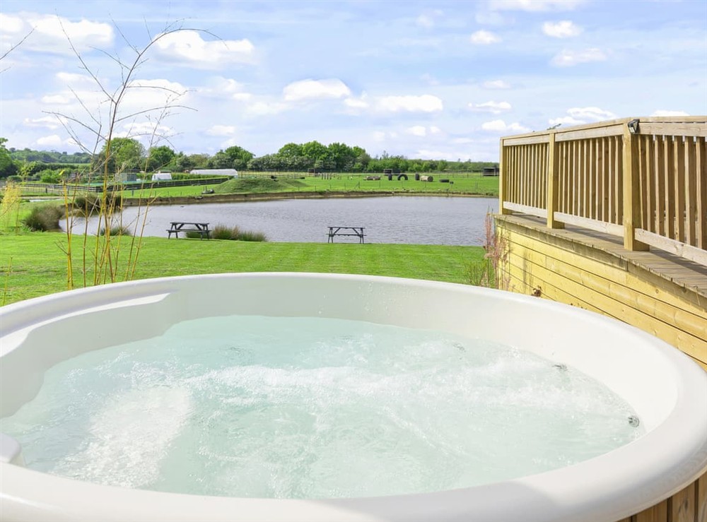 Hot tub at The Water’s Edge Cottage in All Hertfordshire, England
