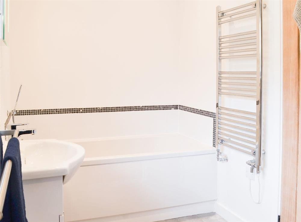 Bathroom with heated rail and full size bath at The Wheel House in Easthill, near Ottery St Mary, Devon