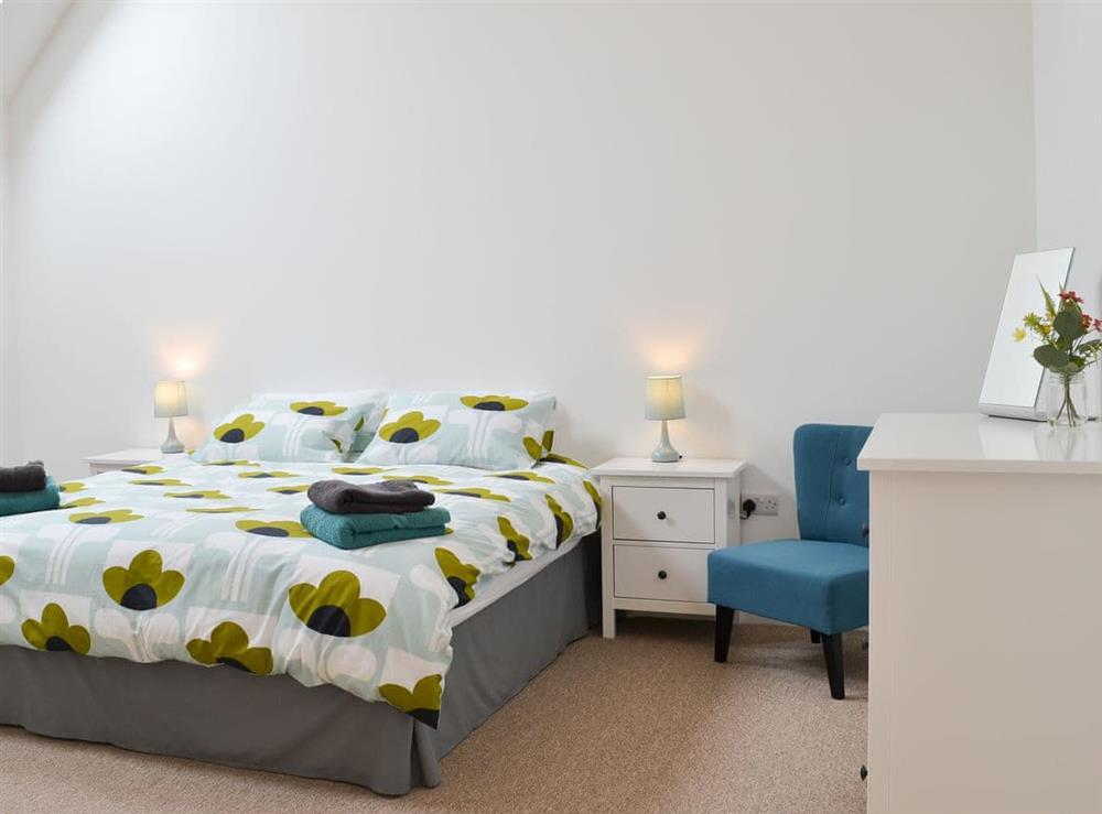 Cosy bedroom with double bed at The Wheel House in Easthill, near Ottery St Mary, Devon