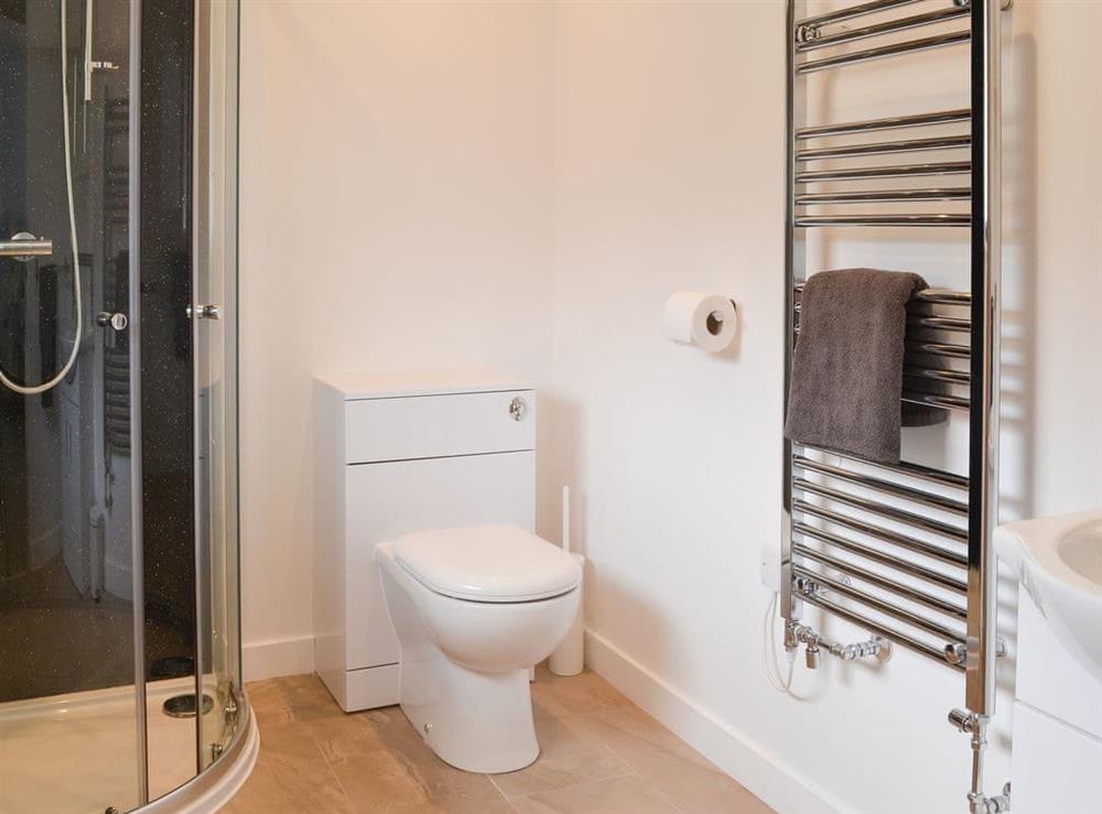 En-suite shower room with heated towel rail at The Wheel House in Easthill, near Ottery St Mary, Devon