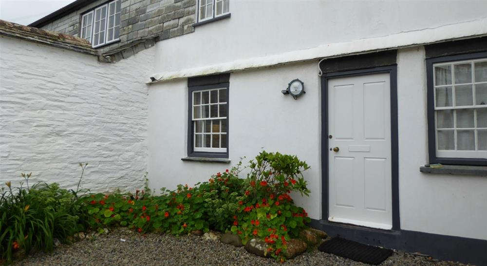 The exterior of The White Cottage, Port Gaverne, Cornwall at The White Cottage in Port Isaac, Cornwall