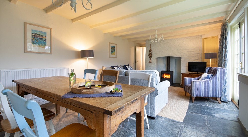 The sitting and dining room (photo 2) at The White Cottage in Port Isaac, Cornwall