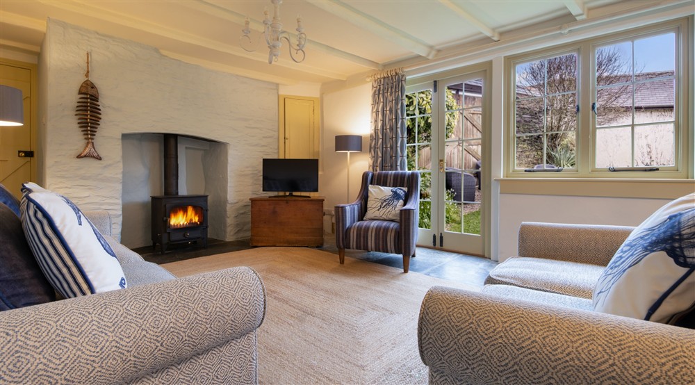 The sitting and dining room at The White Cottage in Port Isaac, Cornwall
