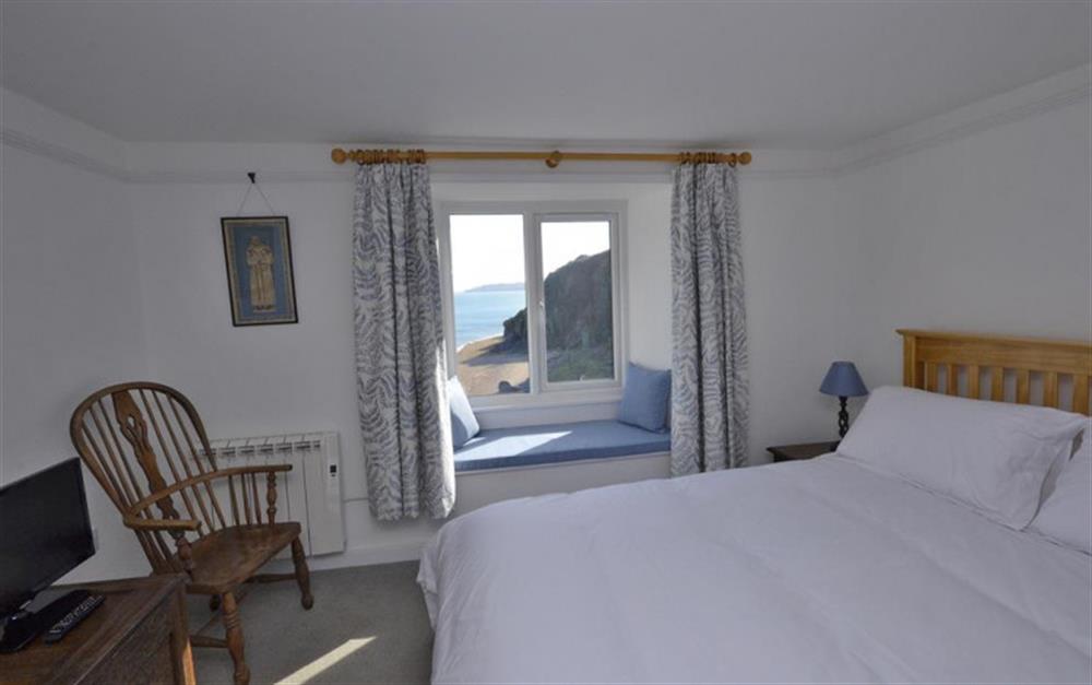 Bedroom 1 with views of the beach below and the sea. at The White House in Torcross