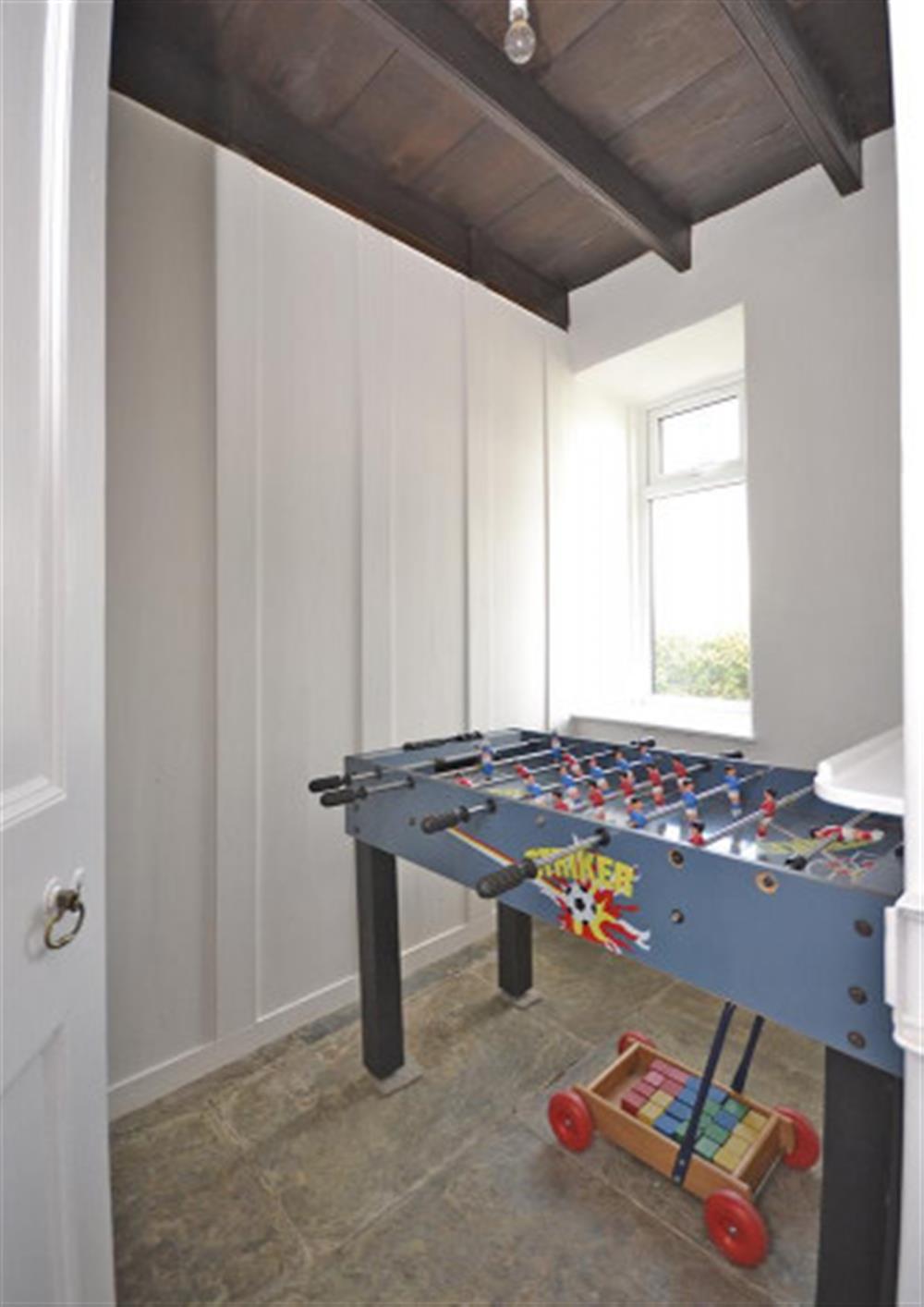 The football table room, off the hall.
