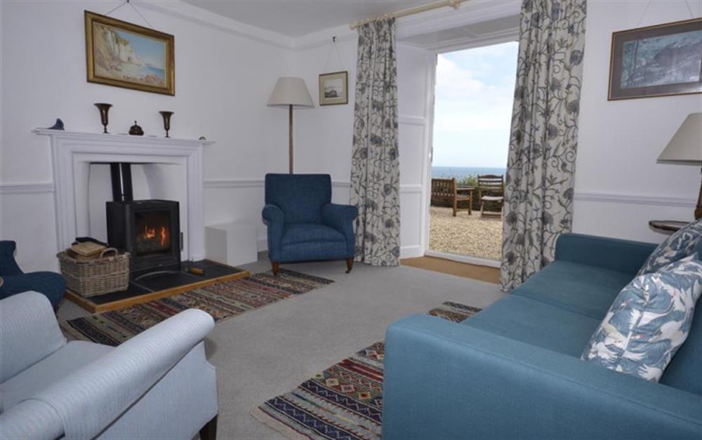 The sitting room with doors to the front terrace. at The White House in Torcross