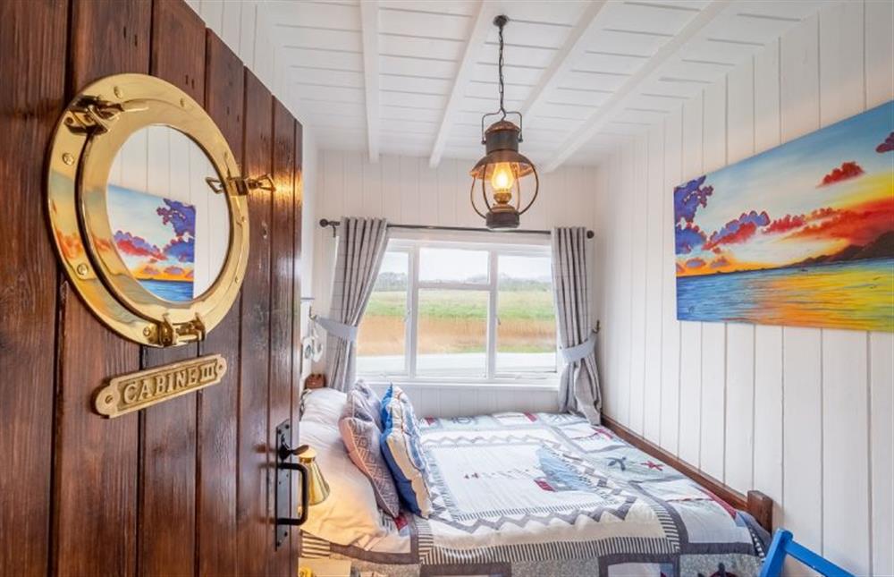 Cabin three has a double bed with access on one side at The Wild Duck, Heacham near Kings Lynn