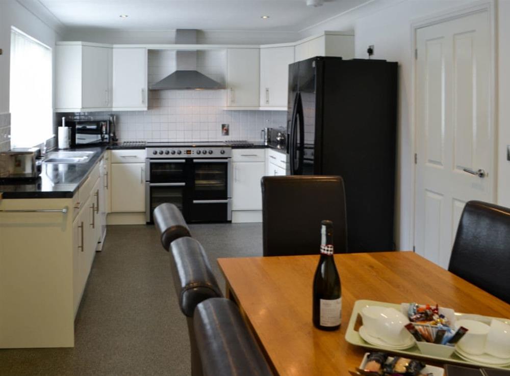 Kitchen with dining area at The Willows in Sea Palling, Norfolk