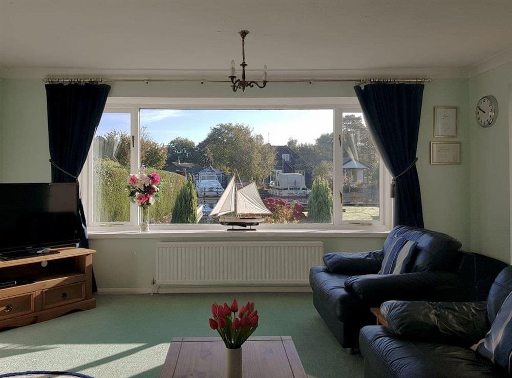 living room with riverside views at The Willows in Wroxham, Norfolk