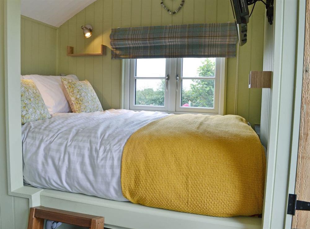 Comfortable bedroom area with double bed at The Wool Shed in Gorran, near St Austell, Cornwall