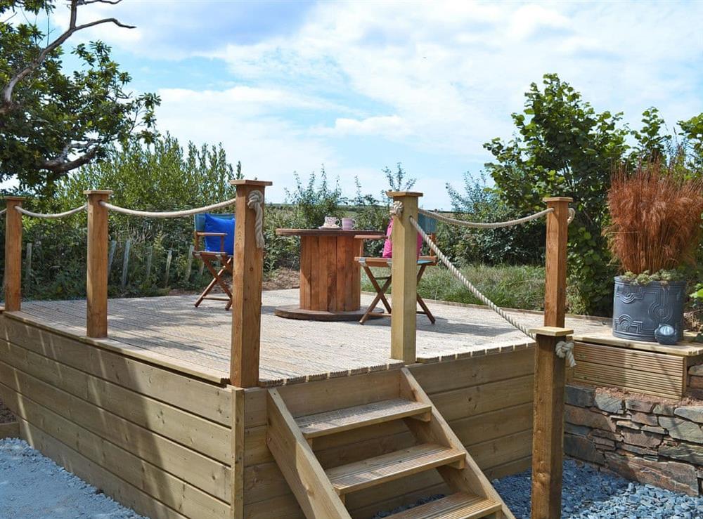 Relaxing decking area with  garden furniture at The Wool Shed in Gorran, near St Austell, Cornwall