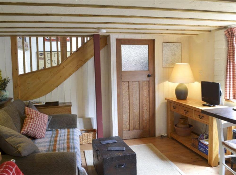 Open plan living space with French doors and beams at The Workshop in Fluxton, near Ottery St Mary, Devon