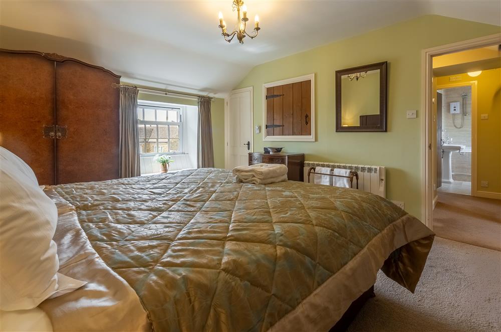 Master bedroom with 6’ super-king size bed (photo 2) at Theaked Stones, Leyburn