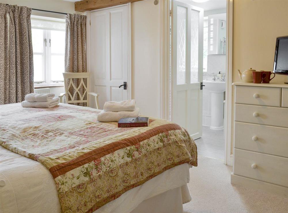 Comfortable double bedroom with en-suite bathroom at Thimble Cottage in Hartland, North Devon., Great Britain