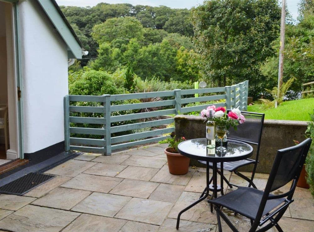 Patio with furniture at Thimble Cottage in Hartland, North Devon., Great Britain