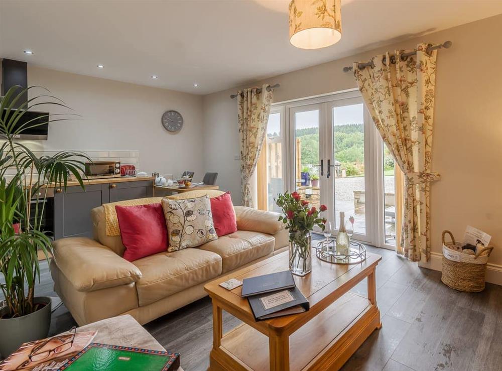 Living area with French doors to the patio at Thistle Cottage in Staintondale, near Scarborough, Yorkshire, North Yorkshire