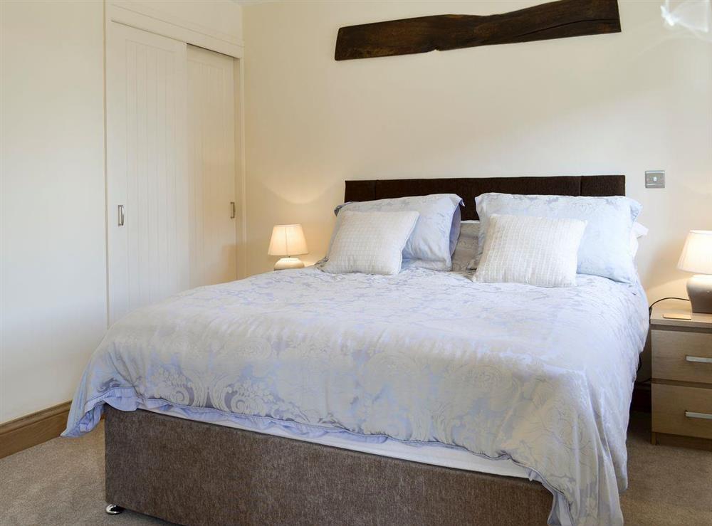 Comfortable double bedroom at The Cartshed, 
