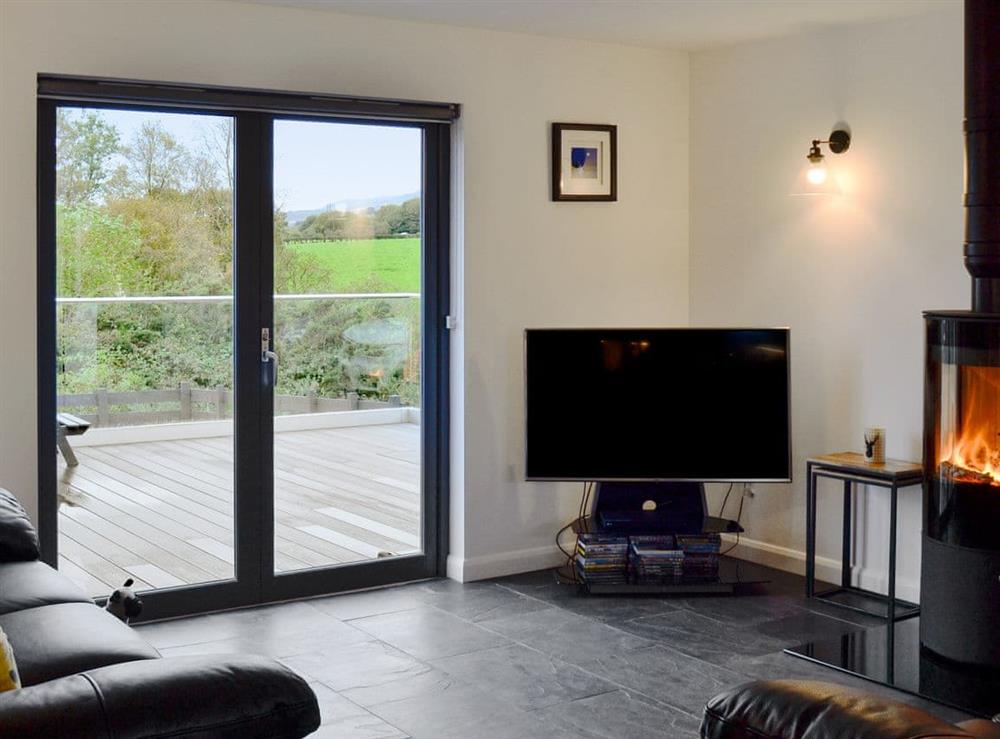 Comfortable living area with cosy wood burner at Thistlebank in Banton, near Kilsyth, Lanarkshire