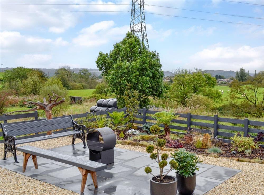 Peaceful garden with ample seating at Thistlebank in Banton, near Kilsyth, Lanarkshire