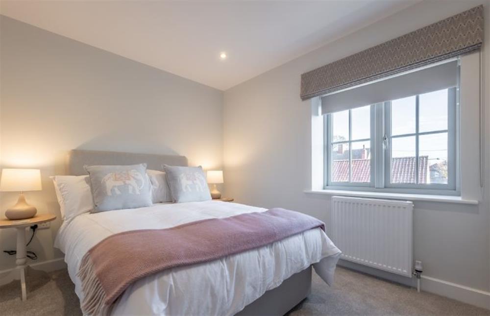 First floor: Bedroom three with double bed at Thistledown, Thornham near Hunstanton