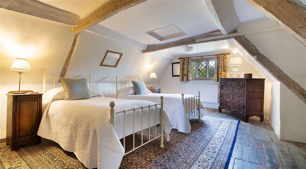 Bedroom 4 Umfreville, with twin beds, on the second floor of Thorington Hall, Suffolk at Thorington Hall in Stoke By Nayland, Suffolk