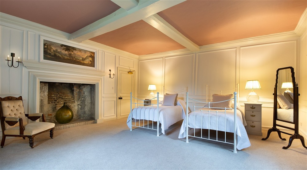 Bedroom 8 Penrose, with twin beds, on the ground floor of Thorington Hall, Suffolk at Thorington Hall in Stoke By Nayland, Suffolk
