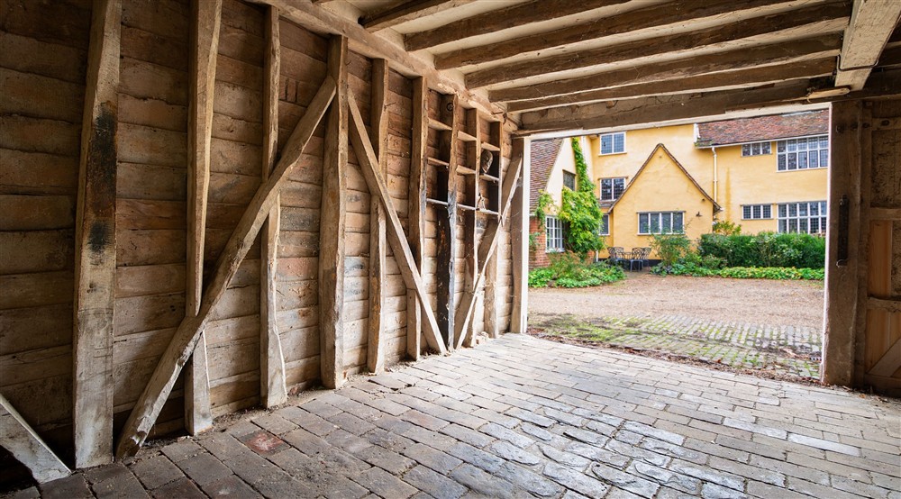 Inside the outbuilding, where bicycles and equipment can be stored, at Thorington Hall in Stoke By Nayland, Suffolk