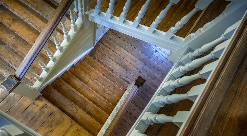 Looking down the east staircase at Thorington Hall in Stoke By Nayland, Suffolk