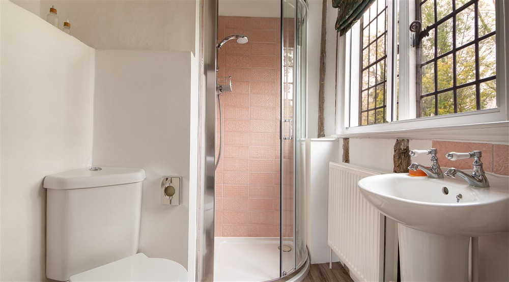 The en-suite shower room of Bedroom 1 Rosier, on the first floor of Thorington Hall, Suffolk at Thorington Hall in Stoke By Nayland, Suffolk