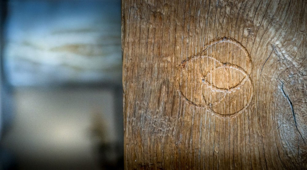 Witch marks carved into the west staircase at Thorington Hall in Stoke By Nayland, Suffolk