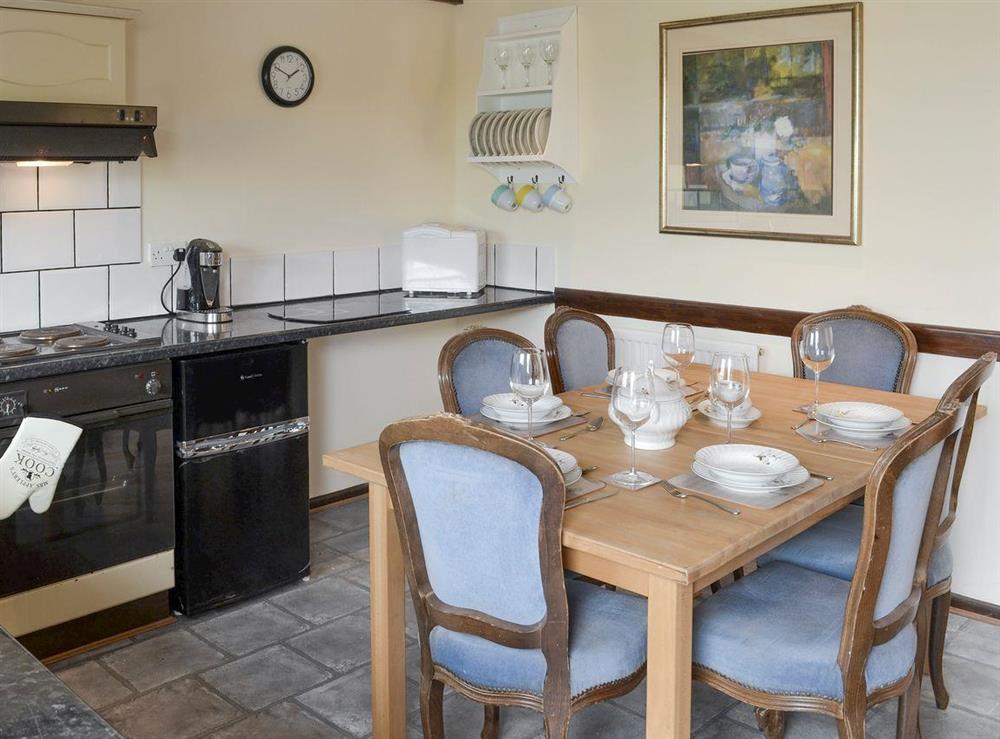 Well-equipped kitchen with dining area at Hazel, 