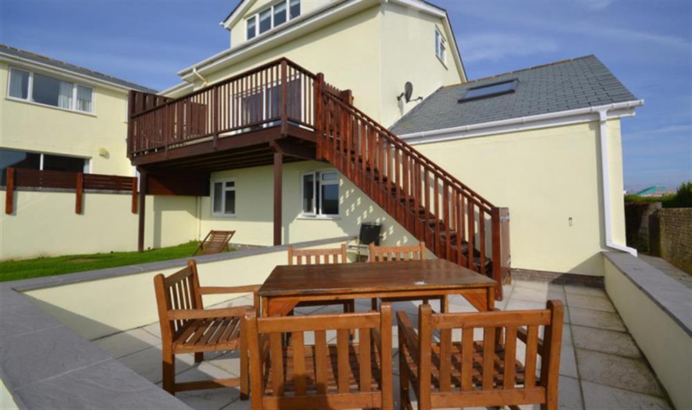 Stairs lead down from the private balcony to patio area, exclusively for guests of Minor.  at Thorpe Arnold Minor in Thurlestone
