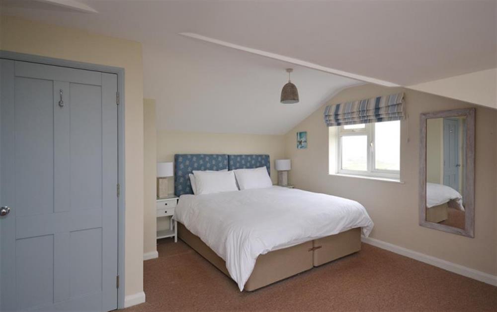 The master bedroom with super king sized bed at Thorpe Arnold Minor in Thurlestone