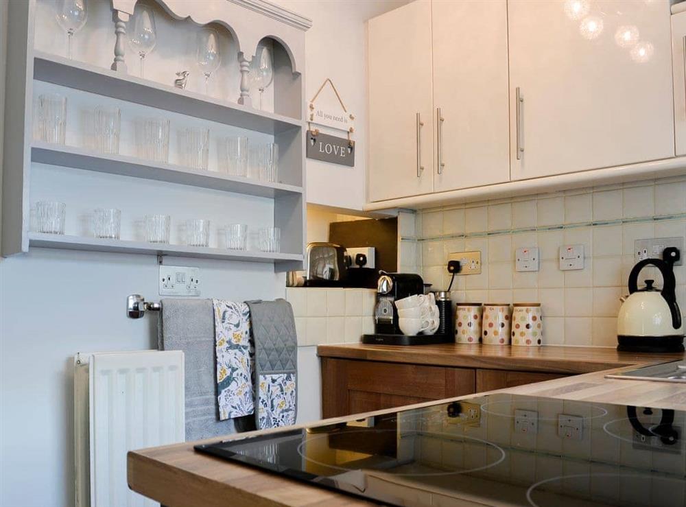 Delightful kitchen with traditional furnishings at Thorpe Cottage in Masham, North Yorkshire