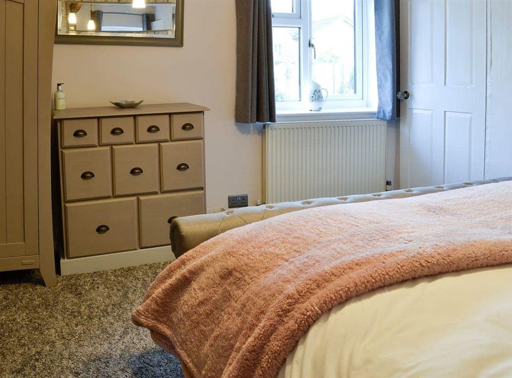 Lovely and bright bedroom with a king sized bed at Thorpe Cottage in Masham, North Yorkshire