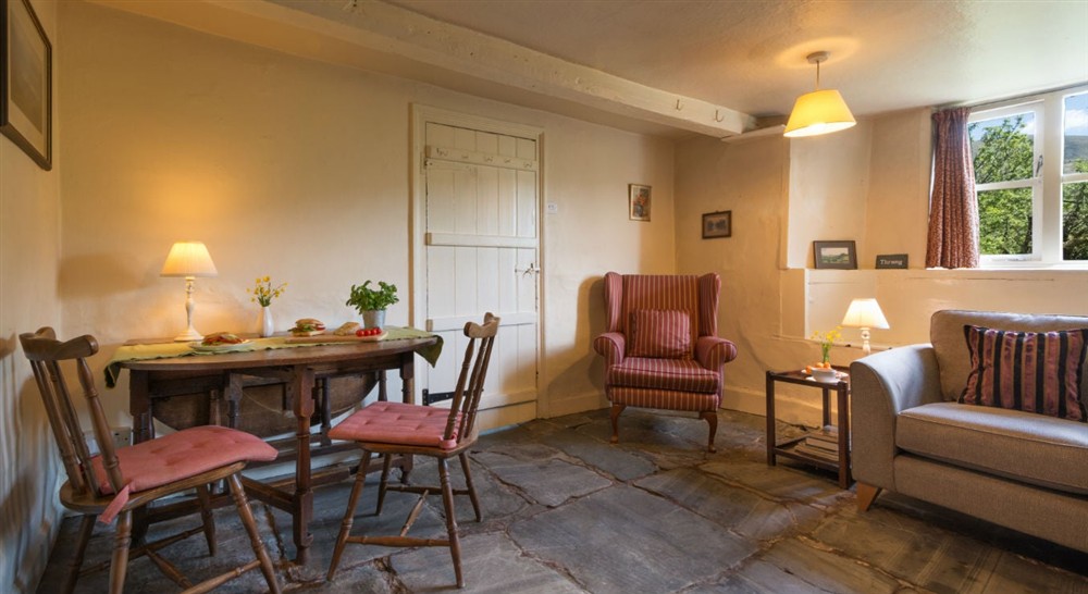 The sitting and dining room at Thrang in Seathwaite, Cumbria