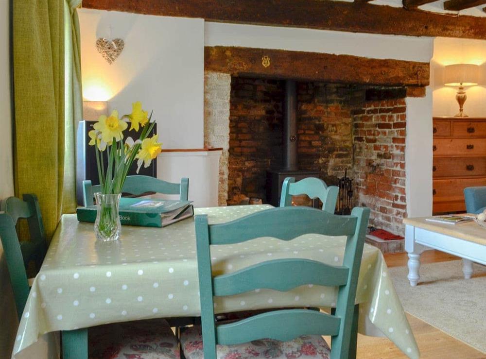 Quaint dining area at Three Ash Cottage in Bungay, Suffolk