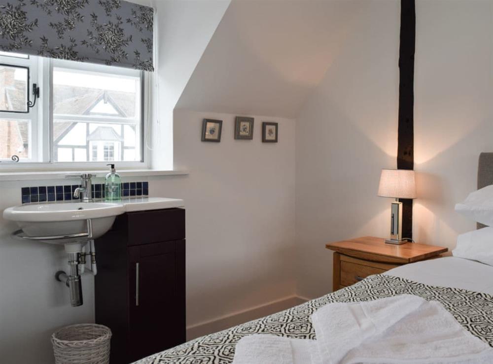 Twin bedroom with wash basin at Three Batch Cottages in Chaddesley Corbett, near Bromsgrove, Worcestershire