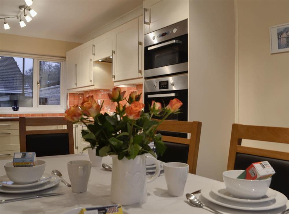 Kitchen and dining area at Three Rivers Cottage in Pont Nedd Fechan, near Glynneath, Powys